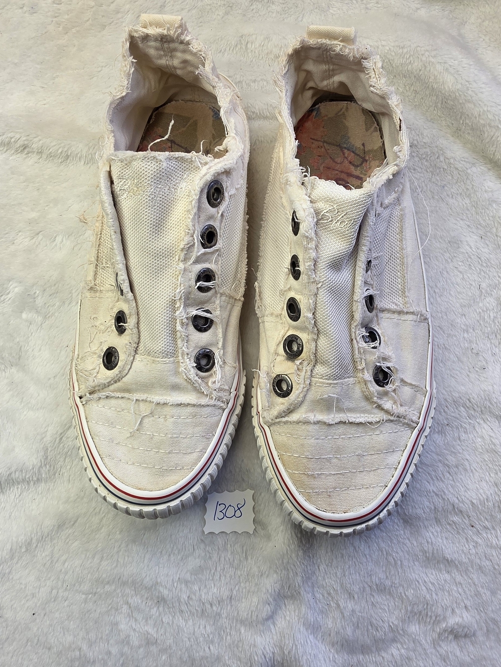 Blowfish Distressed Slip-On Canvas Sneakers in Off-White with Red Stripe